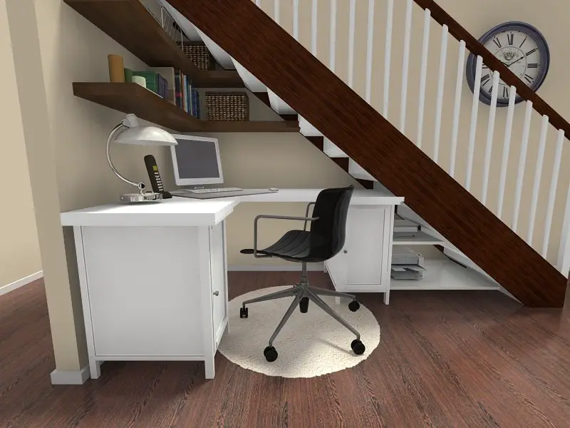 A small home office under the stairs with a desk and chair.