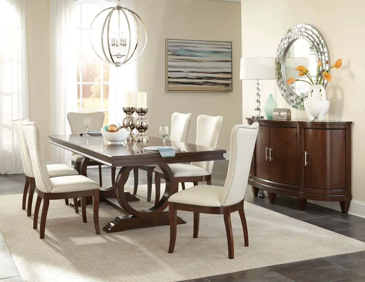 Round dining room set with table and chairs.