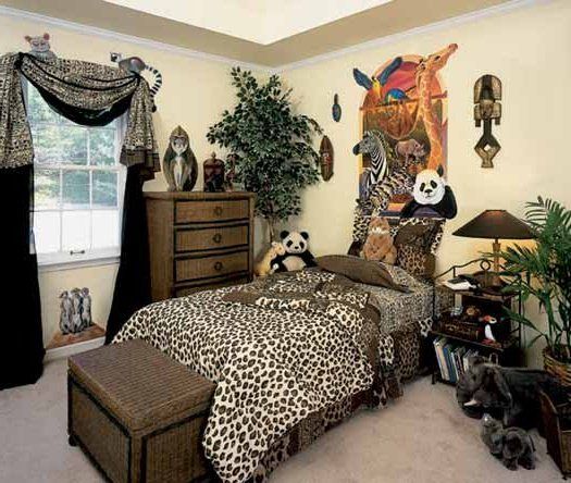 A child's bedroom decorated with animal prints.