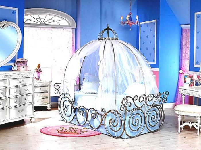 A blue bedroom with a princess bed and dresser - Inspirational Toddler Room Ideas.