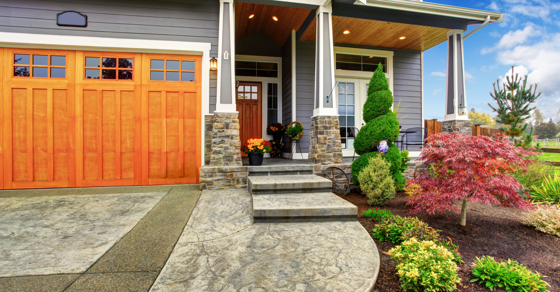 The front of a house featuring outdoor features that boost home value.