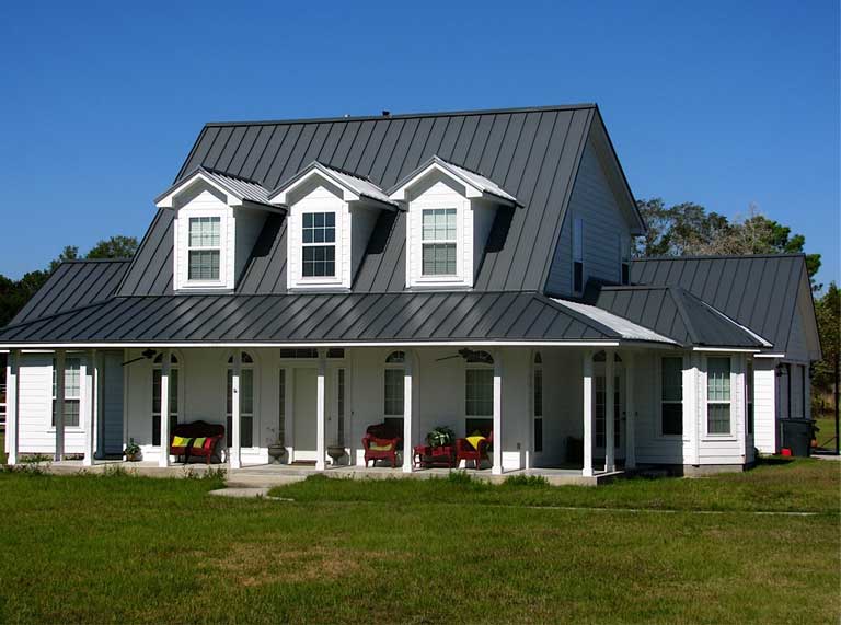 A house with a metal roof and two porches.