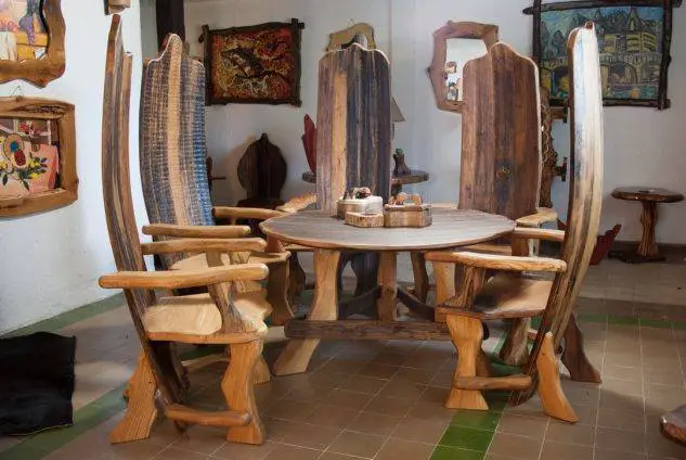 A wooden table and chairs in a room for woodworking projects.