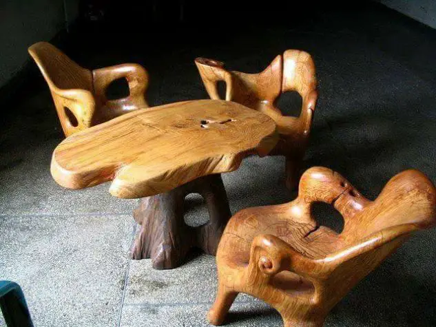 Woodworking project featuring two wooden chairs and a table.