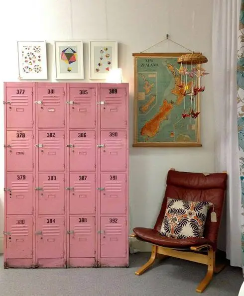 Pink vintage lockers in a room with a rocking chair.