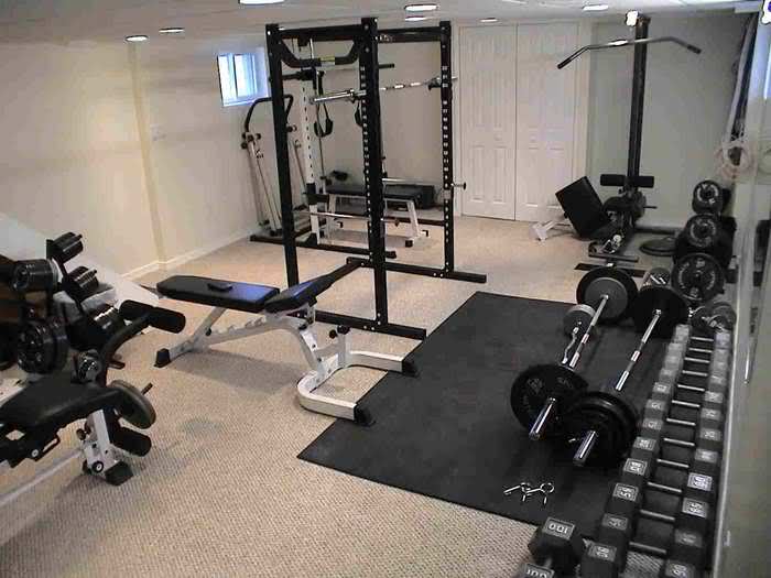 A home gym with a lot of equipment and 7 Perfect Ideas for Remodeling Your Basement.