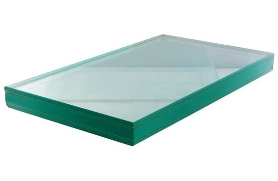 A green glass box installed on a white background, highlighting the need for bulletproof glass in certain locations.