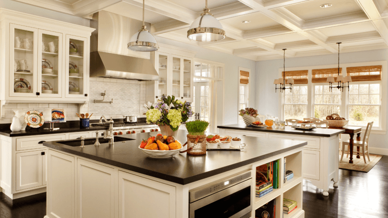 A kitchen renovation with white and black elements.