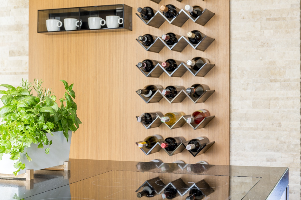 Kitchen décor ideas featuring a wine rack and potted plant.