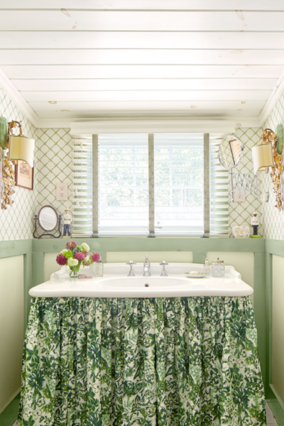 This fabric skirt makes the space under the skin usable while adding some personality to the bathroom.