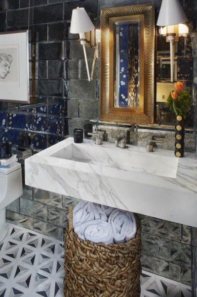 A blue and white bathroom with modern tiles.