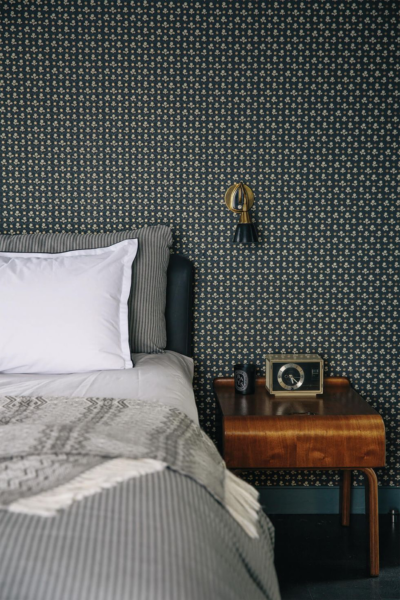 Embrace a blend of grey and black tones for an intimate feel in your guest room