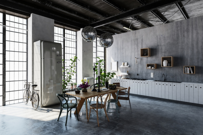 An industrial kitchen design with a table and chairs.