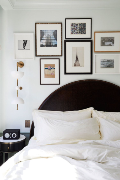 Art, an alarm clock and a radio are excellent ways to make a guest room more homey