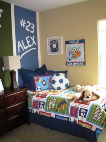A kids' bedroom with a bed and dresser.