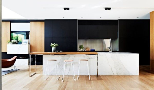 A modern black and white kitchen.