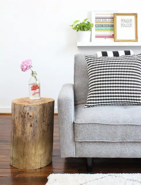 Transform your living room with a budget-friendly update using a gray couch and pillows.