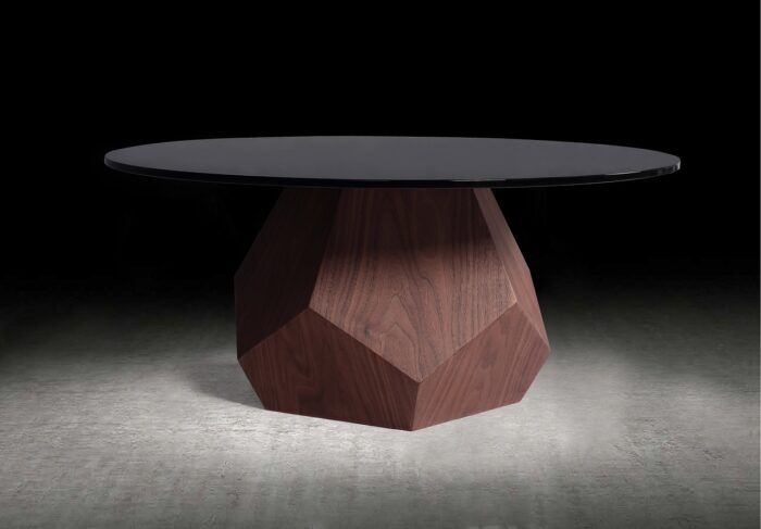 A wooden table with a black top and a black base for small space hacks.