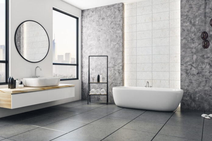 Modern bathroom interior with city view and blank poster on wall.