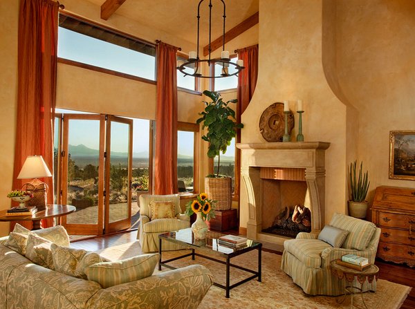 A Tuscan style living room with a fireplace.