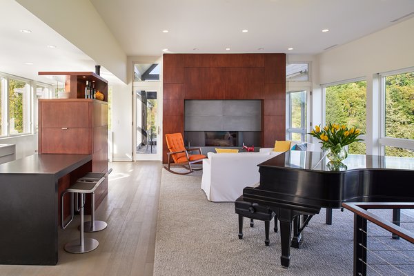 A modern living room with a piano and bar ideas.