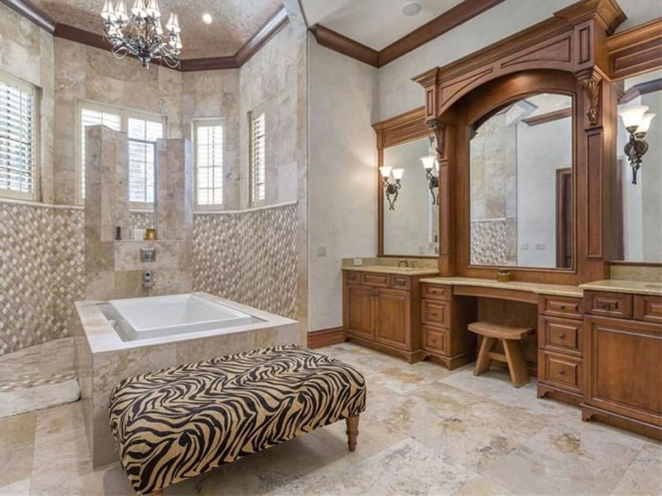 This craftsman bathroom has a unique layout, featuring an open shower are which is directly connected to the square bathtub in the middle