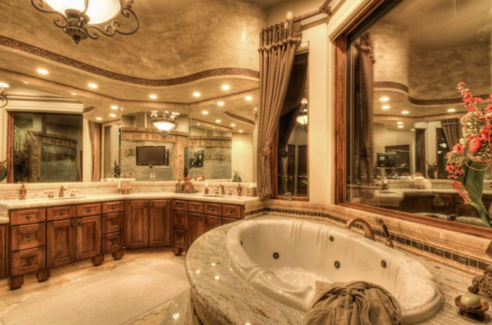 A spacious Craftsman bathroom with a generous tub and sink.