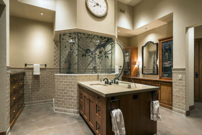 A Craftsman-style bathroom featuring a clock on the wall.