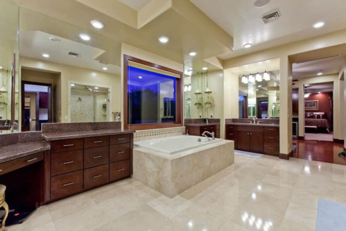 A Craftsman-style bathroom with two sinks and a large tub.