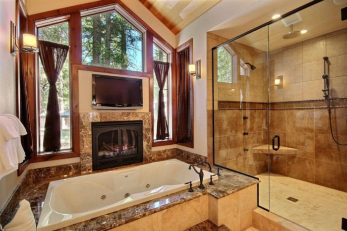 Craftsman-Style Bathroom with a fireplace and tub.