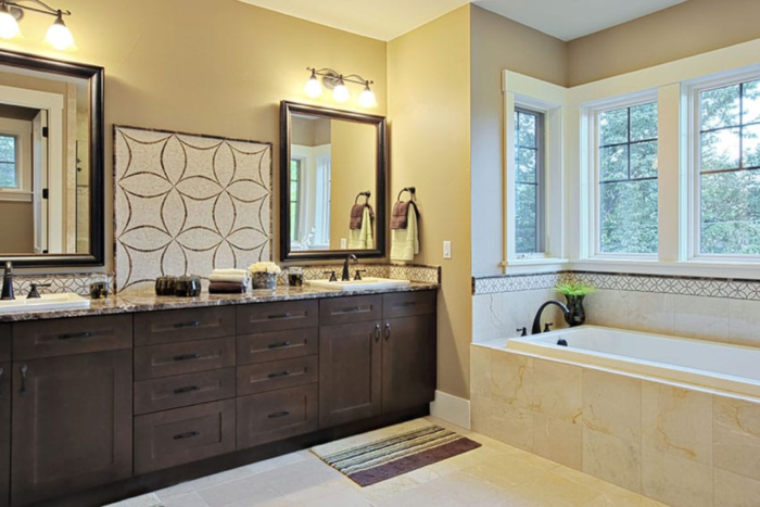 A Craftsman-style bathroom with two sinks and a tub.