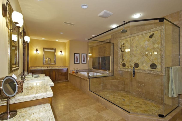 A spacious craftsman-style bathroom with a glass shower stall.