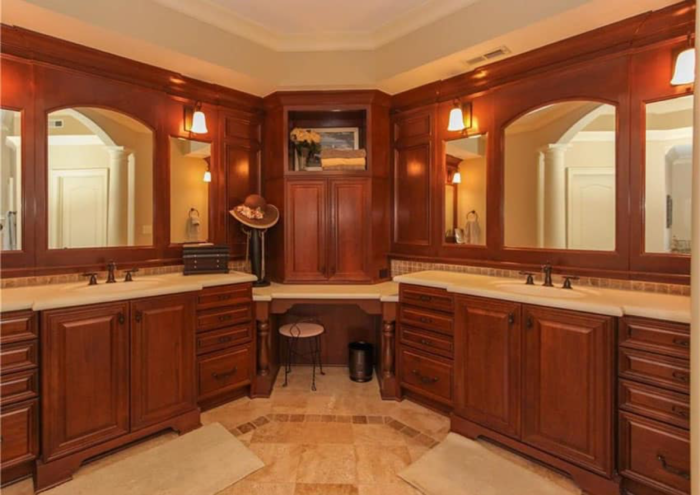 A Craftsman-style bathroom with two sinks and a mirror.