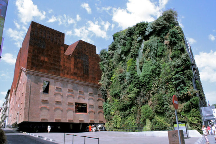 A building with architecture featuring a green wall.