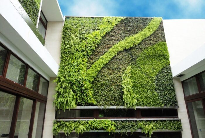 A building featuring a green wall as part of its architecture.
