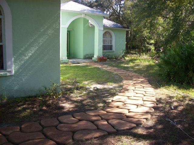 A pathway leading to a garden.