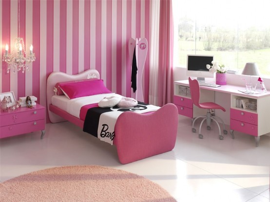 A girl's bedroom with pink and white walls.