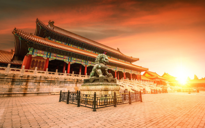 The cool architecture of the Forbidden City in Beijing at sunset.