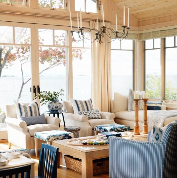 Beach-themed living room with ocean view.