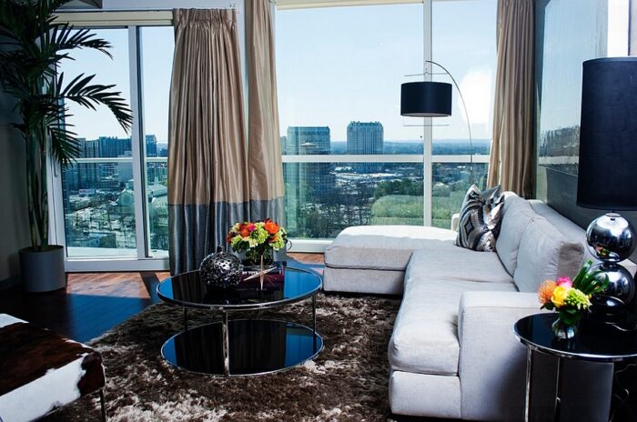 A masculine living room with a view of the city.