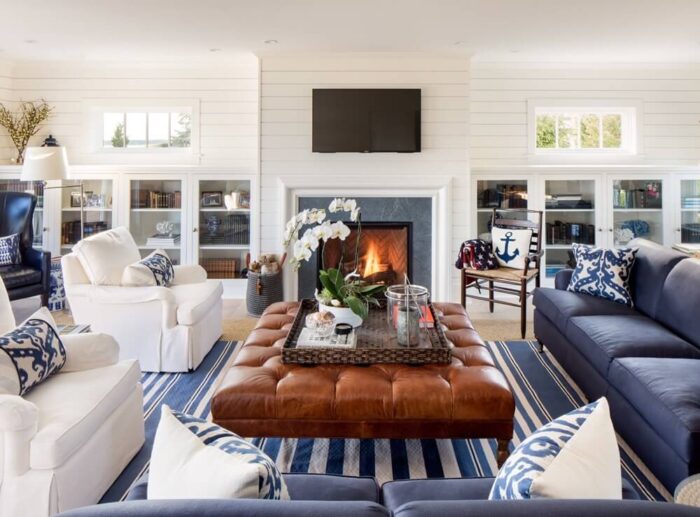 A beach-themed living room with a fireplace.