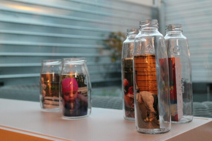 Glass bottles with decorative pictures inside.