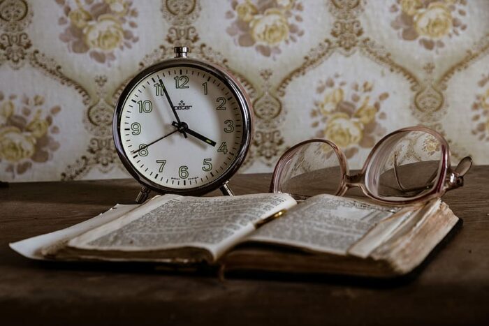 Photo ideas: Clock, book, table.