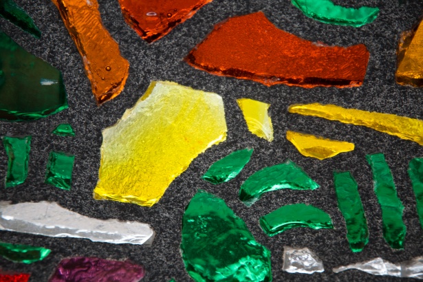 A close up of colorful glass pieces, perfect for art in a living room.