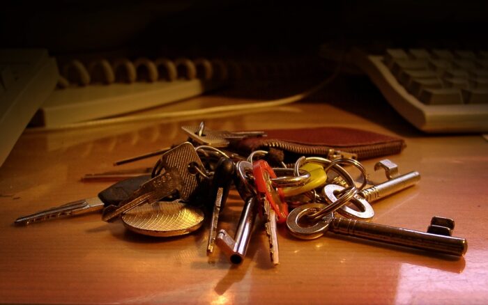 A bunch of keys on a desk.