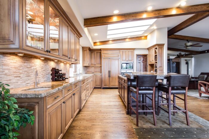 A spacious kitchen with wood cabinets and a center island.