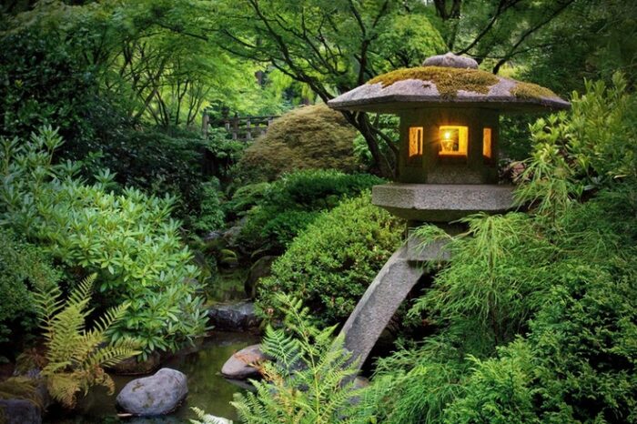 A Zen garden featuring a lantern at its center.