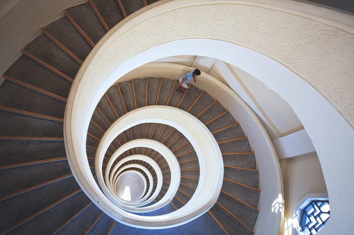 A building's spiral staircase offering unique photo ideas.