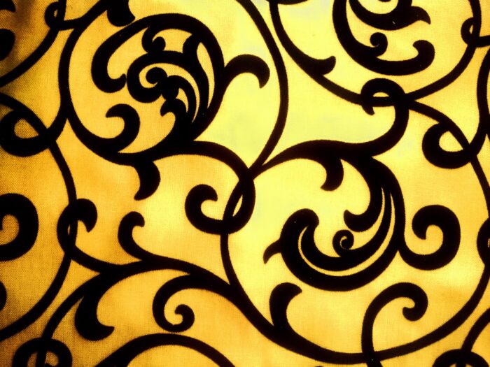 A yellow background with an ornate pattern.