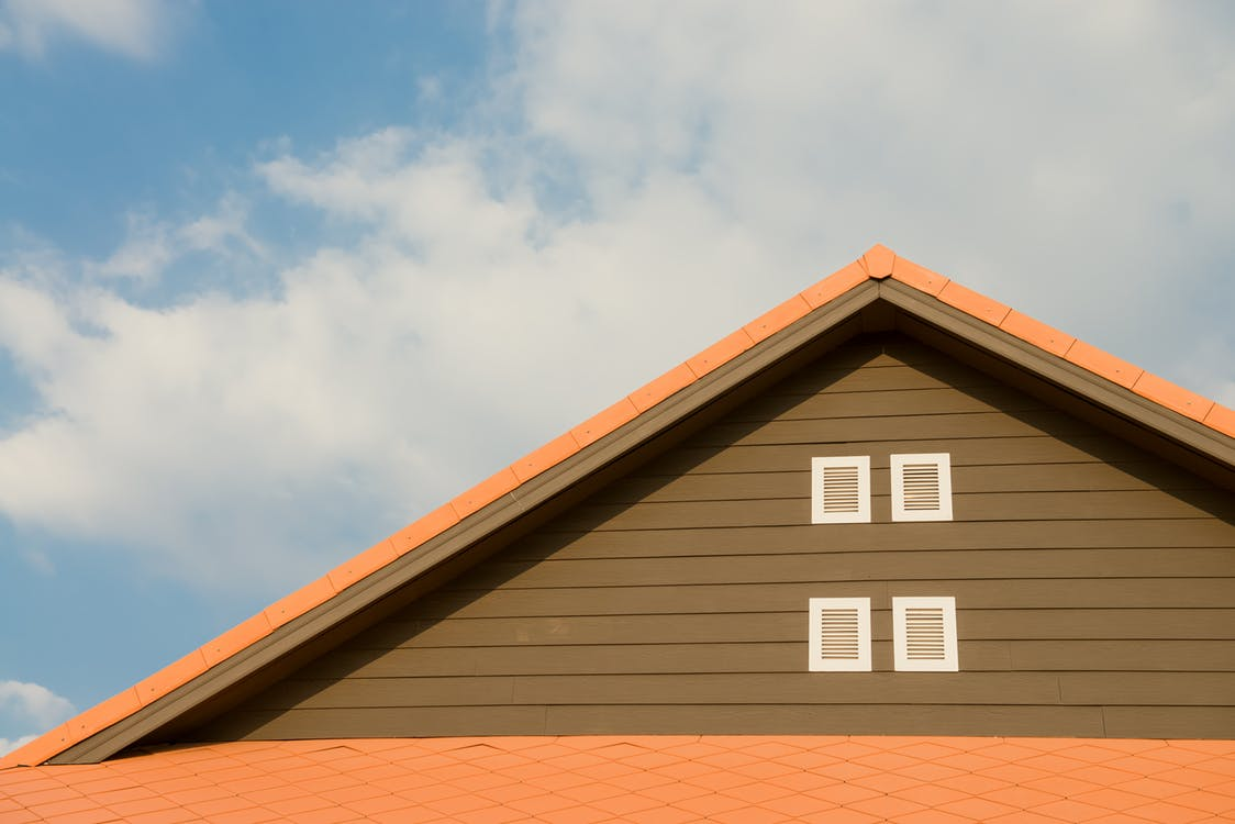 The roof of a house with a window on it, home projects